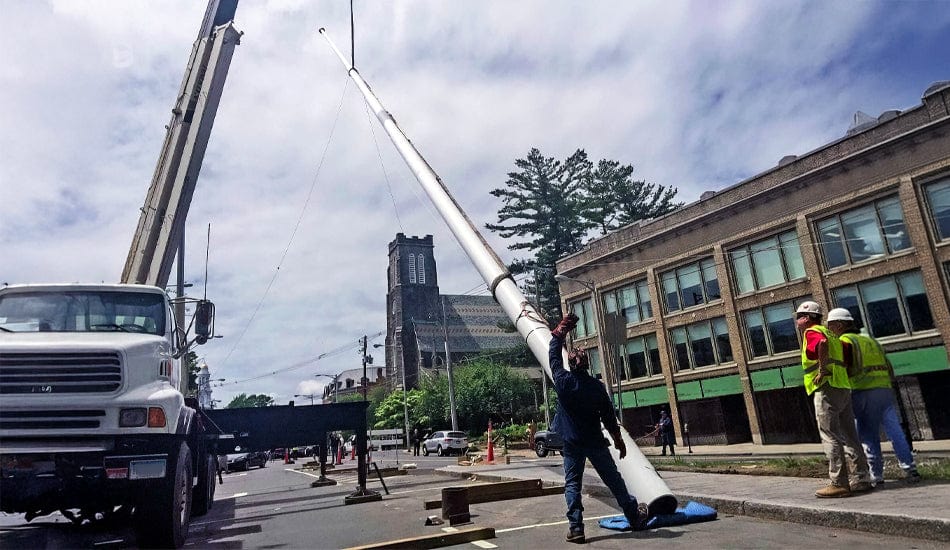 Commercial Flagpole Installation: Costs, Considerations, and Crane-Sized Challenges