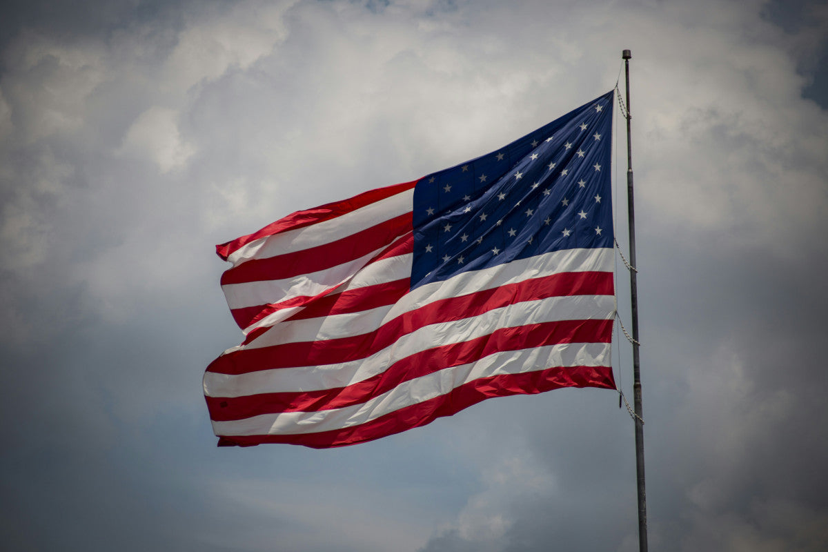 how to install flagpole on house