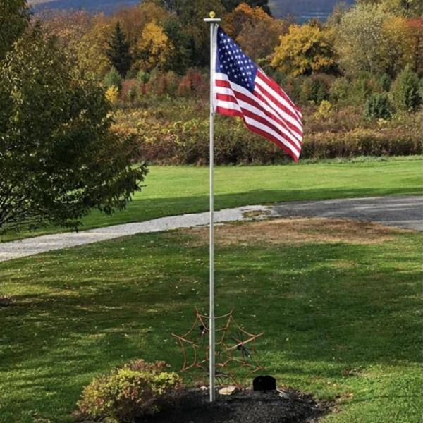 Clear Liberty Telescoping Flagpole in a fall yard